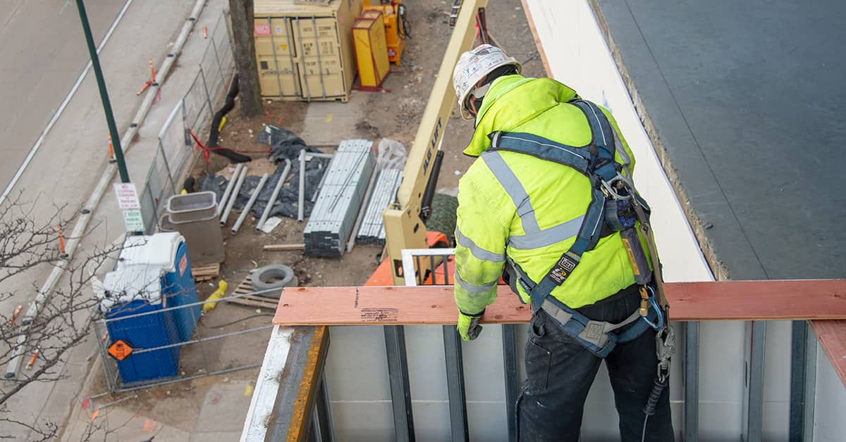 Construction Worker wearing Fall Protection while working