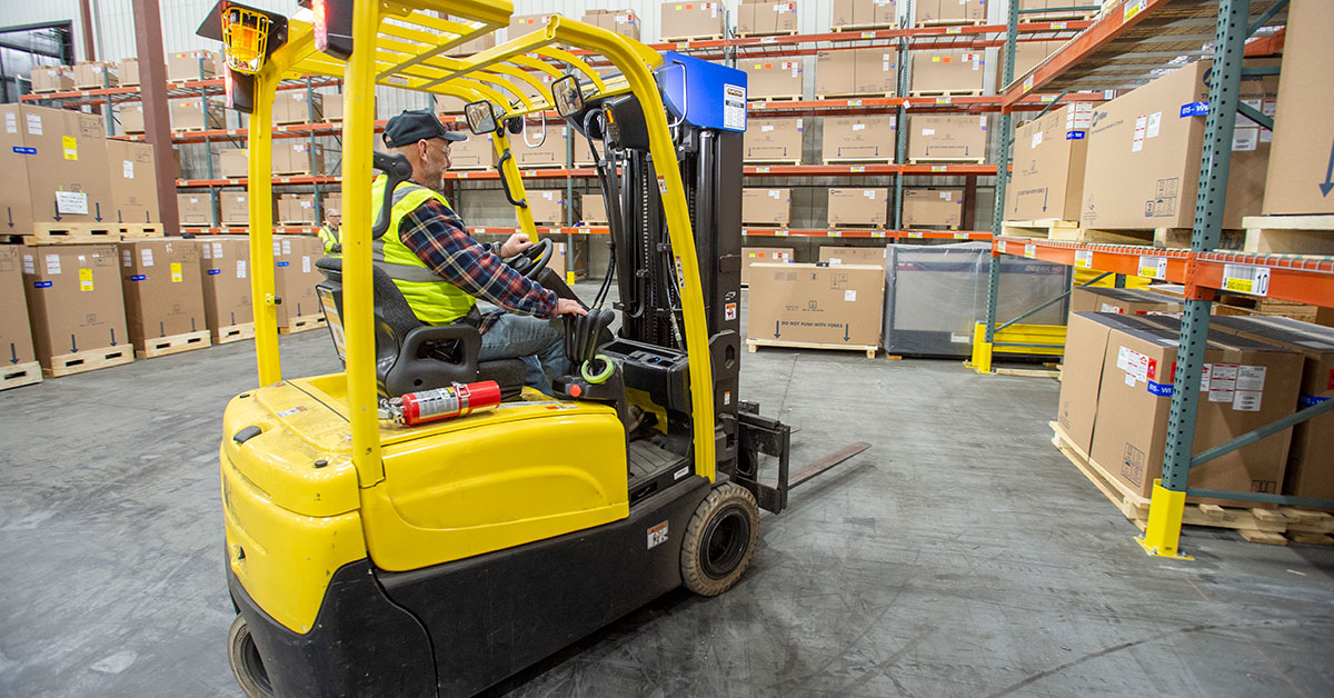 Forklift in use in warehouse